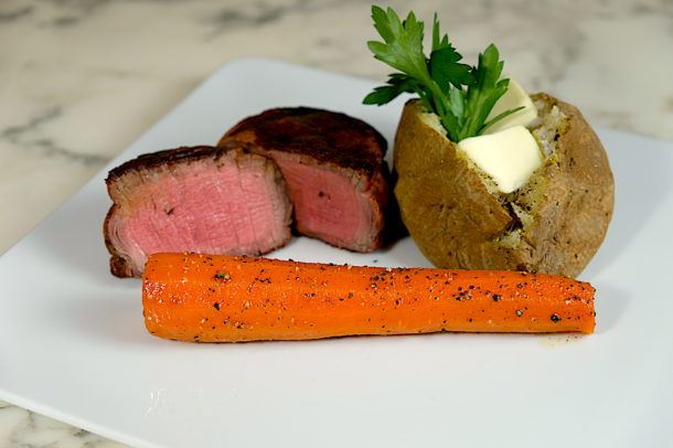 Steak house carrots on the grill 